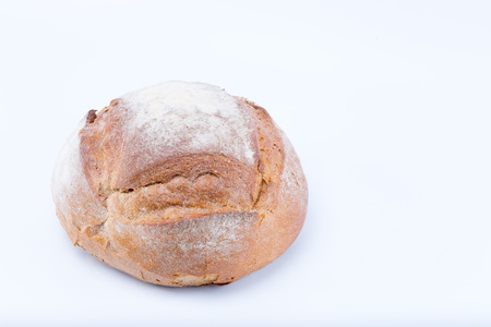 Rustic medieval loaf of bread isolated on white backgroundの写真素材