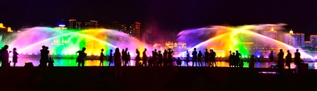 People at a light fountain in a cityのeditorial素材
