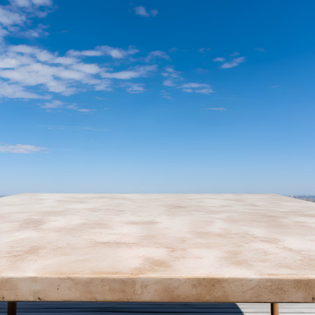 Empty top of white marble table with blue sky background. For product displayの素材