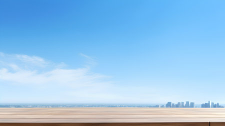 Wooden table top on blue sky and city background. For product displayの素材