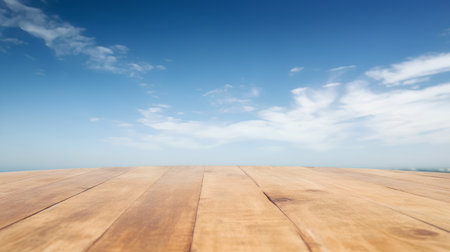 Wooden floor with blue sky and white clouds. Abstract background.の素材