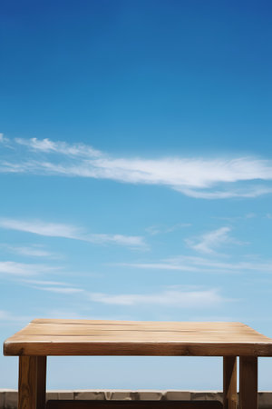 Wooden table top on blue sky background. For montage product displayの素材