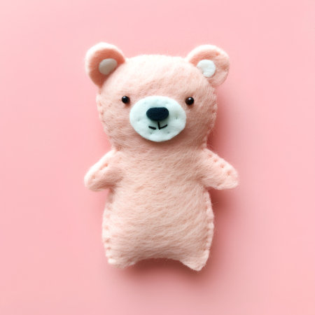 Soft toy teddy bear on a pink background. Flat lay, top view.の素材