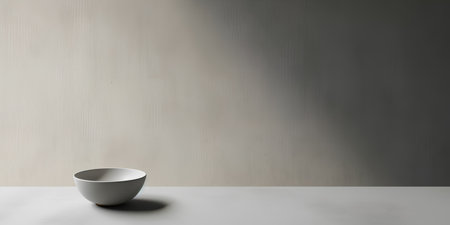 Empty ceramic cup on white table in front of concrete wall. 3d renderの素材
