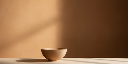 Empty wooden bowl on the table with shadow on the wall. 3d renderingの素材
