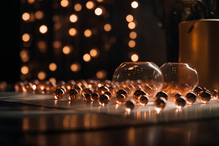 Close up of chess board with golden balls on the table. Black backgroundの素材