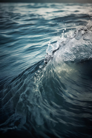 Underwater view of blue ocean wave with splashes. Toned.の素材