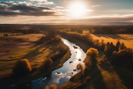 Aerial view of the autumn landscape with river and forest at sunsetの素材