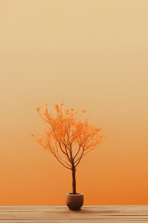 Tree in pot on wooden table with orange background. 3d renderingの素材