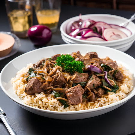 Beef stroganoff with rice in a white plate on a black backgroundの素材