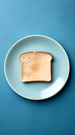 Sliced toast bread on blue plate over blue background, top viewの素材