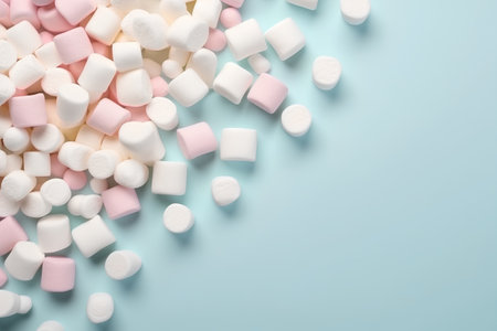 Colorful marshmallows on pastel blue background with copy spaceの素材