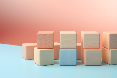 Wooden cubes in a row on a blue background. 3d renderingの素材