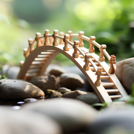 Wooden toy train with stones on green nature background. Selective focusの素材