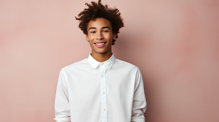 Young african american woman in white shirt on pink background.の素材