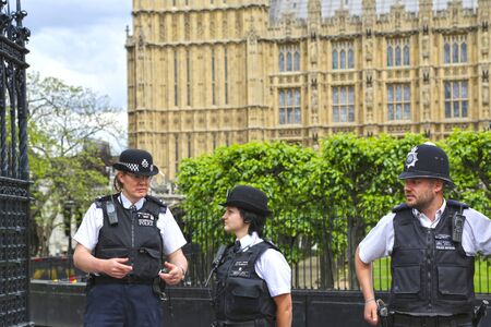 London, Great Britain -May 22, 2016: English police near Westminster Palace, the Houses of...