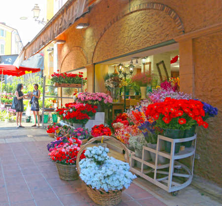 Nice, France - June 11, 2014: Traditional mediterranean houses and flower shop on the street of the old town in Nice, Franceのeditorial素材