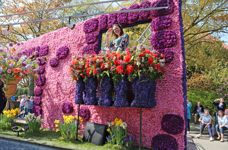 Sassenheim, Netherlands - April 21, 2018: 100 years Bloemencorso Bollenstreek Flower Parade traditional folk holidayのeditorial素材