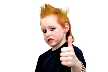 Rebel kid with yellow hair making scary faceの写真素材