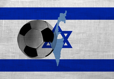 Football ball on the national flag of Israelの写真素材