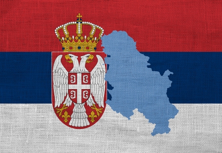 Flag and map of Serbia on a sackclothの写真素材