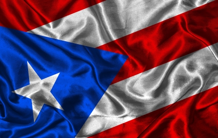 Waving colorful Puerto Rico flag on a silk backgroundの写真素材