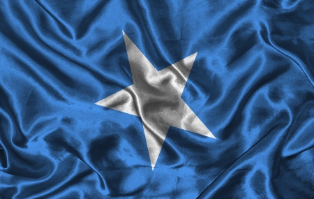 Waving colorful Somalia flag on a silk backgroundの写真素材