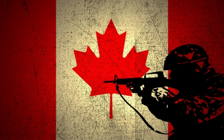 A silhouette of a soldier on the Grunge Canadian Flagの写真素材