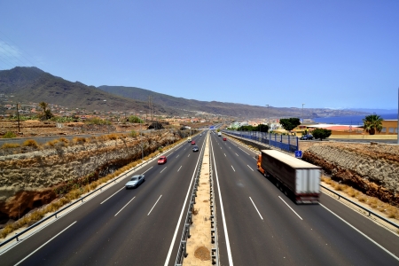 Panoramic view of a three-lane motorway near the sea coast