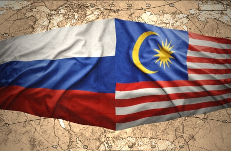 Waving Malaysian and Russian flags of the political map of the worldの写真素材