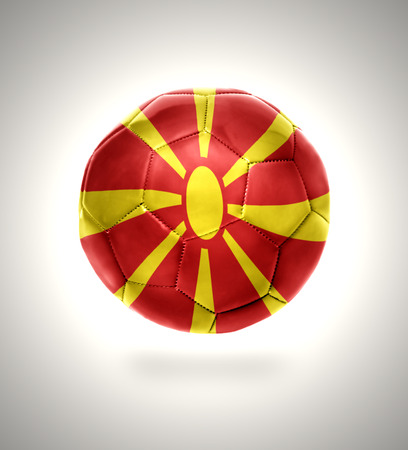 Football ball with the national flag of Macedonia on a gray backgroundの写真素材
