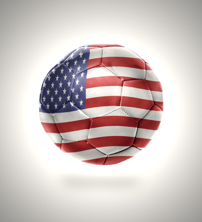 Football ball with the national flag of American on a gray backgroundの写真素材