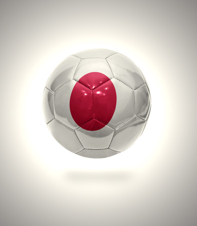 Football ball with the national flag of Japan on a gray backgroundの写真素材