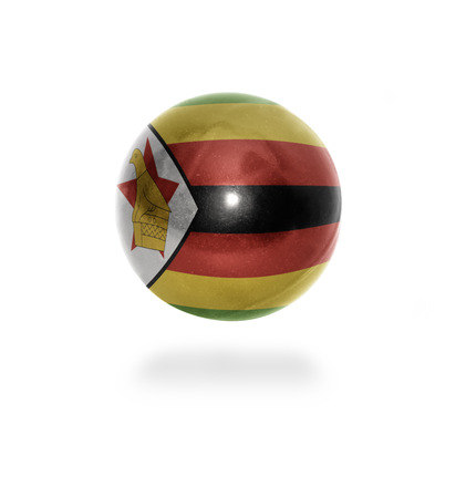 Flag of Zimbabwe on the ball isolated on whiteの写真素材