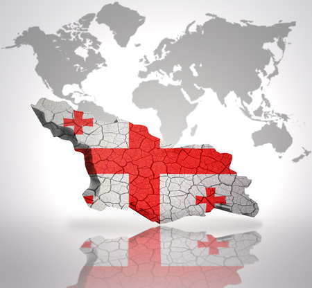 Map of Georgia with Georgian Flag on a world map backgroundの写真素材