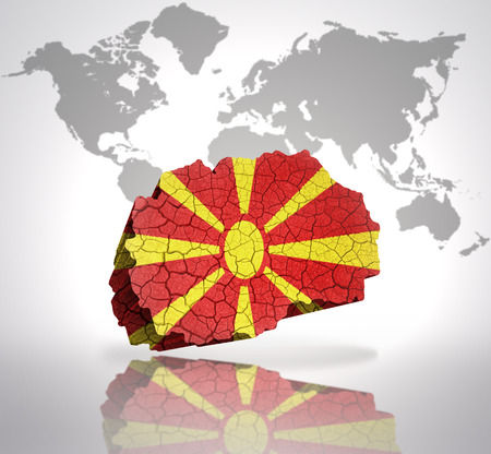 Map of Macedonia with Macedonian Flag on a world map backgroundの写真素材
