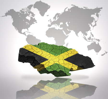Map of Jamaica with Jamaican Flag on a world map backgroundの写真素材