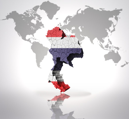 Map of Thailand with Thai Flag on a world map backgroundの写真素材