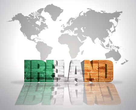 Word Ireland with irish Flag on a world map backgroundの写真素材