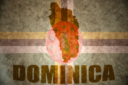 dominica map on a vintage dominica flag backgroundの写真素材