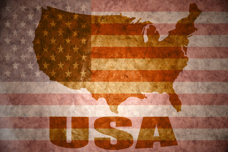 united states of america map on a vintage american flag backgroundの写真素材