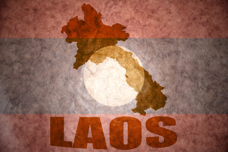 laos map on a vintage laotian flag backgroundの写真素材