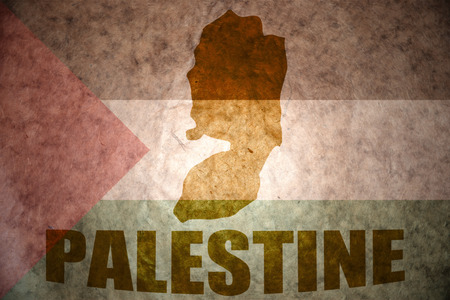 palestine map on a vintage palestinian flag backgroundの写真素材