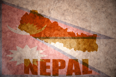 nepal map on a vintage nepali flag backgroundの写真素材
