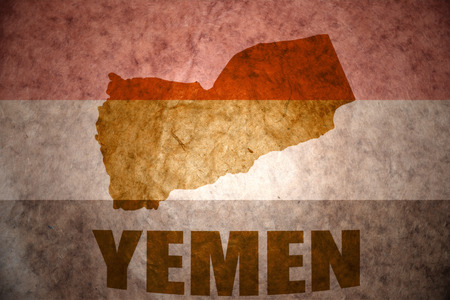 yemen map on a vintage yemeni flag backgroundの写真素材
