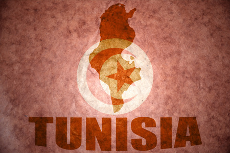 tunisia map on a vintage tunisian flag backgroundの写真素材