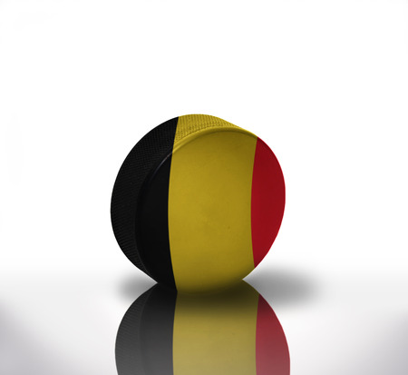 vintage old hockey puck with the belgian flagの写真素材