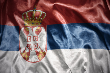 waving and shining serbian flagの写真素材