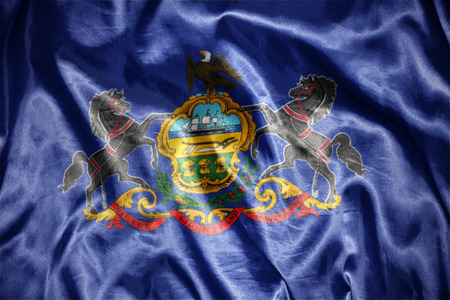 waving and shining pennsylvania state flagの写真素材