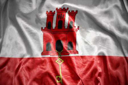 waving and shining gibraltar flagの写真素材